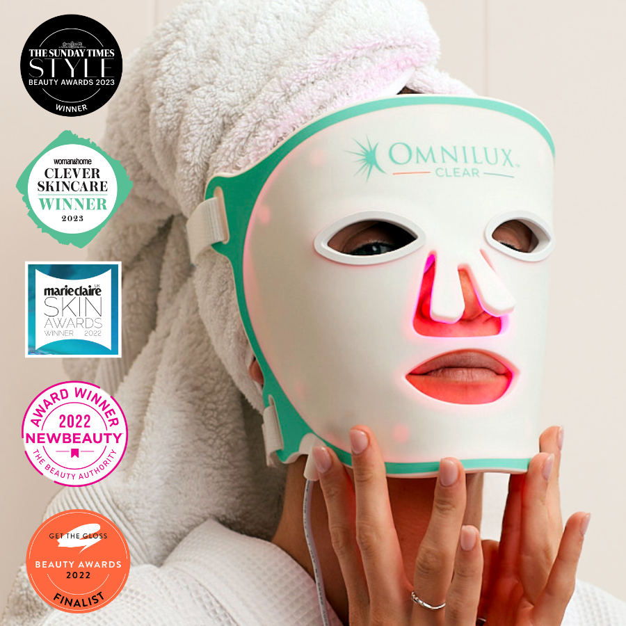 Girl wearing omnilux clear light therapy mask with award icons