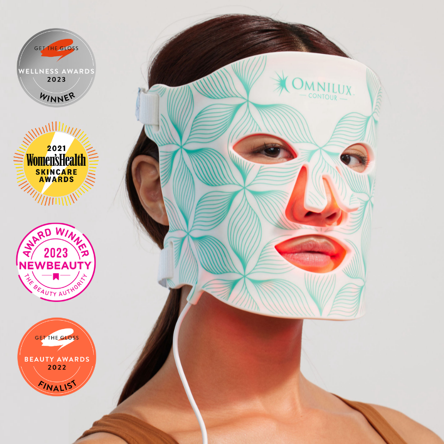 Woman wearing omnilux contour light therapy mask with award icons