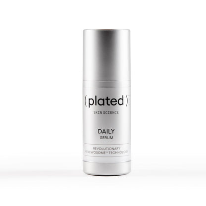 plated daily serum silver skincare bottle white background